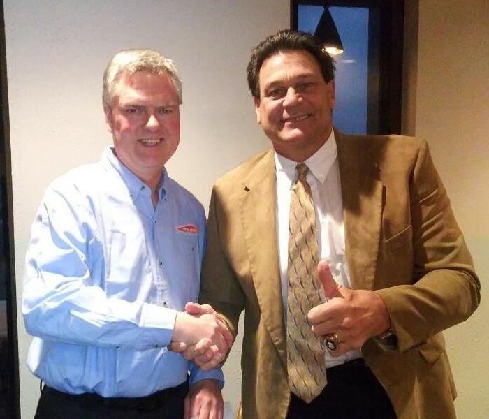 Sales Manager shaking hands with Chicago Bears player