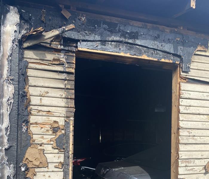 Burned doorway of a garage.